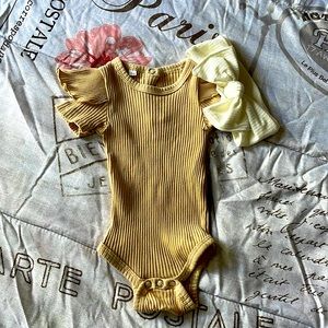 Beautiful tan newborn onesie with an off white headband to match